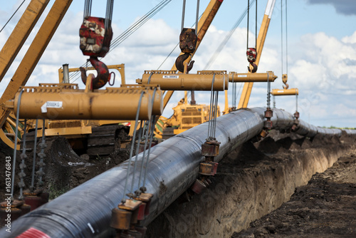 Installation of a huge industrial gas pipe line on a field