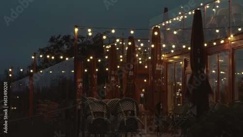 Summer cafe near the sea at night
