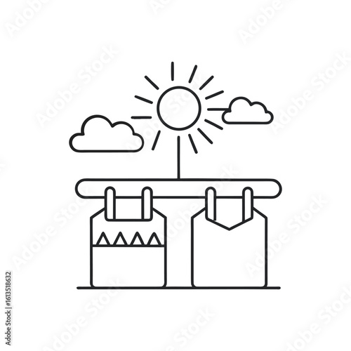 Laundry drying on a clothesline under the sun and clouds isolated on white background