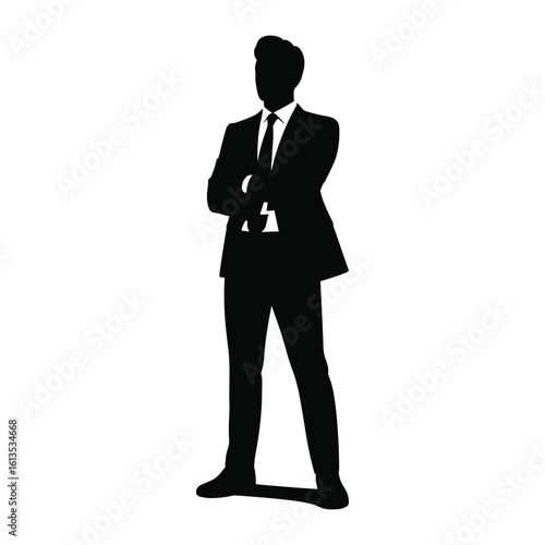 Silhouette of a confident businessman standing with arms crossed