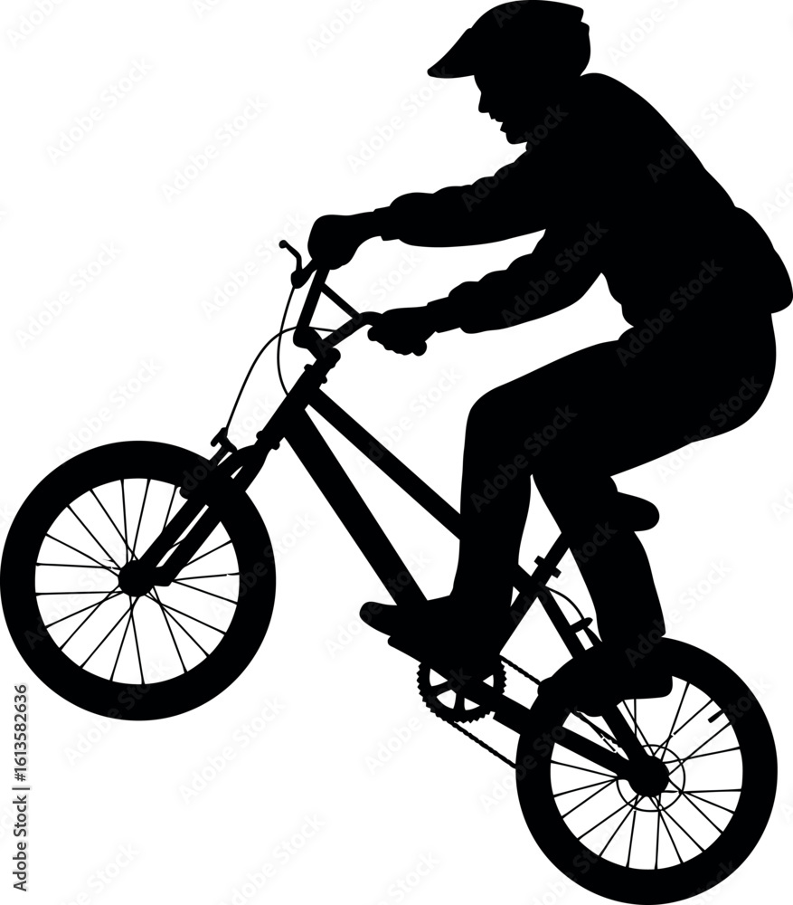 Fototapeta premium Bmx rider silhouette performing wheelie