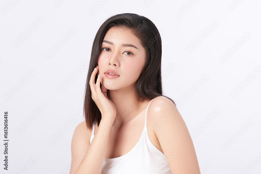A beautiful young Asian woman with clean, fresh skin against a white background. Skincare, facial treatment, cosmetology, beauty, and spa. An elegant portrait of an Asian woman. A beautiful young Asian woman with clean, fresh skin against a white background. Skincare, facial treatment, cosmetology, beauty, and spa. An elegant portrait of an Asian woman.