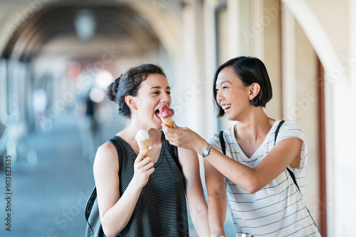 Two young women with ice cream cones