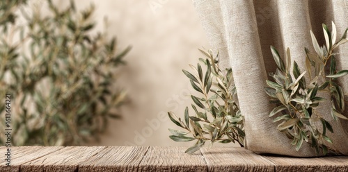 Rustic wooden table with olive branches and linen curtain