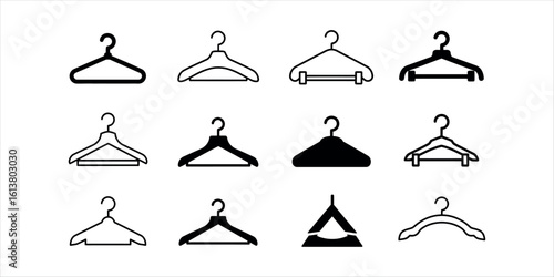 Collection of twelve black and white clothing hangers on white background clothes hanger garment hanger