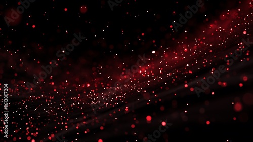 Red particles against a dark background with subtle light effects bokeh