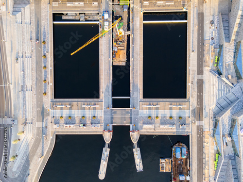 Canvas Print Vattentorget, Slussen, Stockholm, vertical view of people walking on the bridge over the water linking Gamla Stan and Södermalm