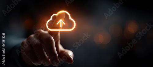 Hand points to glowing cloud upload icon