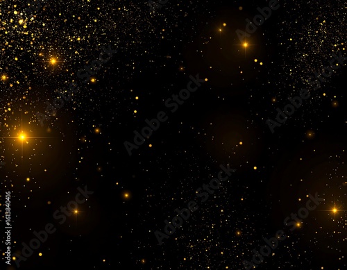 Golden glitter sparkles on black background
