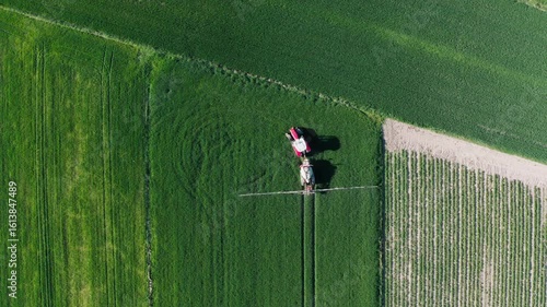 Aerial View of Tractor in Green Farm Field