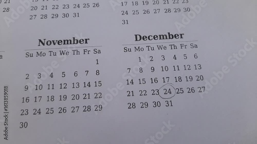 marking the december 24 date on the calendar	
