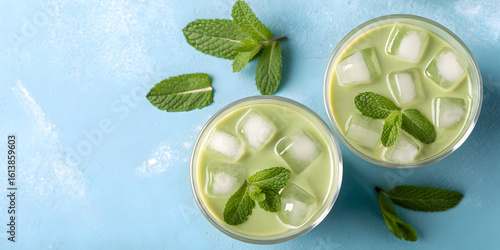 Wallpaper Mural two iced matcha teas mint ice cubes blue background Torontodigital.ca