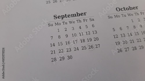 marking September 26 date on the calendar	
