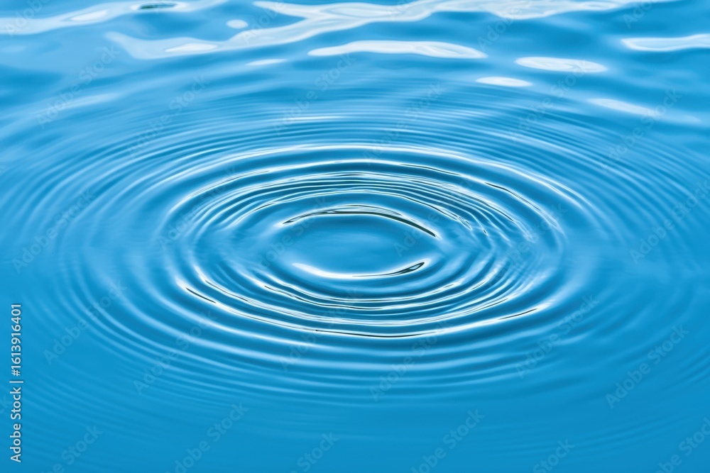 Close-Up View of Water Ripples Creating Circular Patterns on Calm Blue Surface, Capturing Tranquil Nature and Serenity in Every Detail Close-Up View of Water Ripples Creating Circular Patterns on Calm Blue Surface, Capturing Tranquil Nature and Serenity in Every Detail