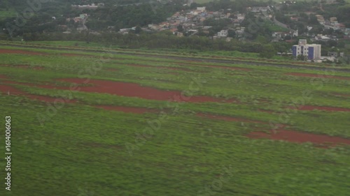Aerial plane landing in runway POV