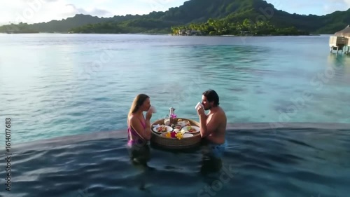Couple in Bora Bora (French Polynesia)
Enjoying a floating breakfast in a private pool over the blue sea.