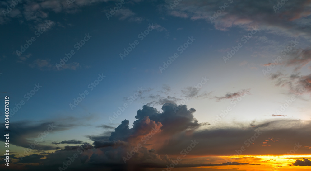 Fototapeta premium Amazing sunset skyscape. Evening sky with bright colorful orange and yellow clouds