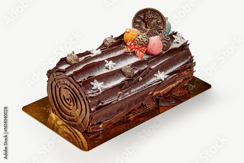Konstfotografi Delicious chocolate yule log cake decorated with christmas ornaments and icing s