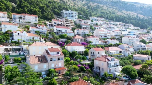 4K Aerial Drone Footage Over Dubrovnik City Center, Croatia, Revealing Residential Homes and Urban Landscape with Clear Blue Sky
