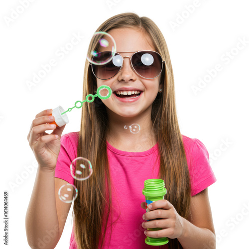 A happy girl with sunglasses is blowing bubbles, enjoying a playful summer day.