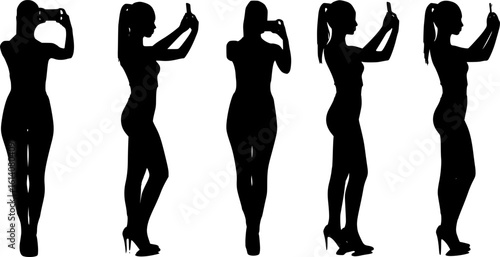 Silhouette of a woman taking a selfie with her smartphone, capturing modern digital culture and self-expression.
