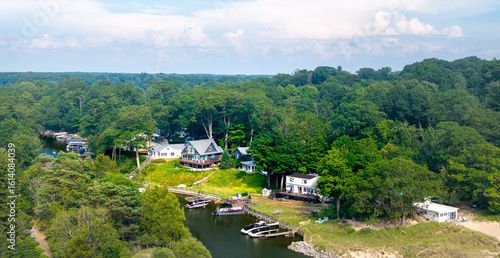 Fototapeta Aerial View of Riverside Homes and Forest Landscape in Norton Shores, Muskegon,