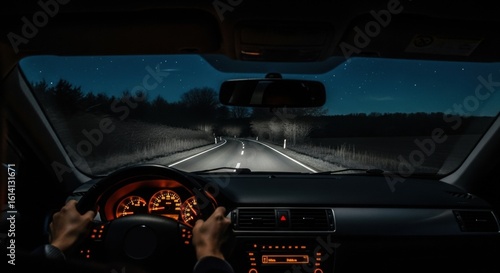 Man driving car during night with headlights on. First person view from inside vehicle on dark road. Evening transport.