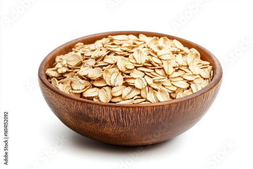 Rolled oats in a wooden bowl on a white background, showcasing natural texture and color with a focus on simple and nutritious ingredients for a healthy lifestyle