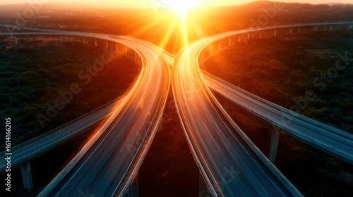 A breathtaking sunset paints the sky over a modern highway intersection, symbolizing journeys, transitions, and the beauty of nature merging with urban landscapes.