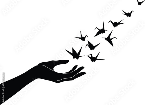 Poetic Silhouette of Origami Hand Releasing Paper Cranes