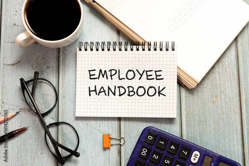 Employee handbook text concept write on notebook