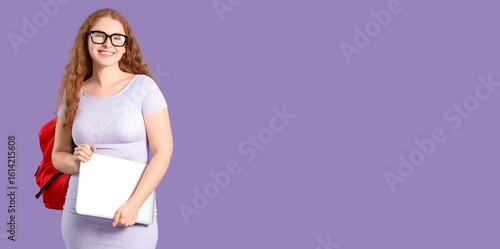 Happy female student with b...
