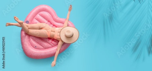 Young woman in swimsuit lyi...