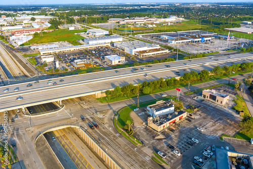 Photography Capturing multi lane highway intersection surrounding commercial complex in Hous