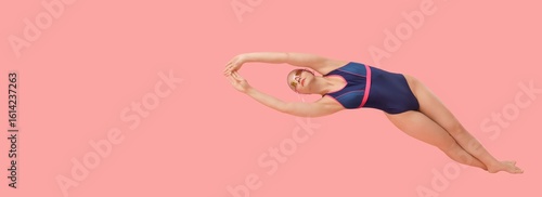 Female swimmer on pink back...