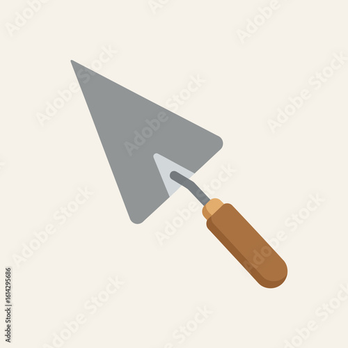 A gray trowel with a brown handle is isolated on a light background.