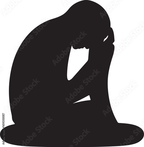 Black silhouette of person hunched over covering face in despair grief sadness
