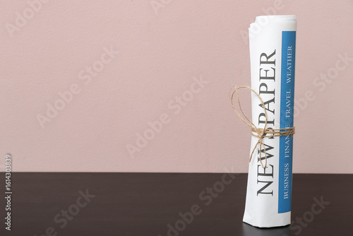 Newspaper on black wooden t...