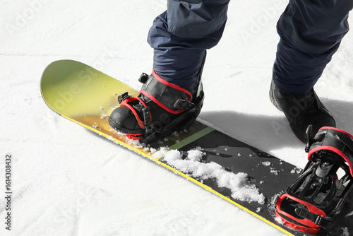 Male snowboarder on ski pis...