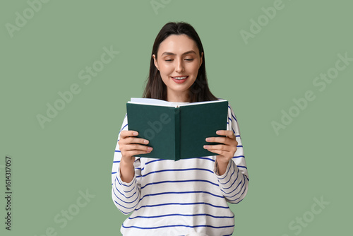 Young pretty woman reading ...