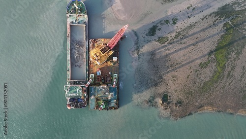 Slika na platnu Aerial View of Dredging Barge and Crane at Coastal Construction Site