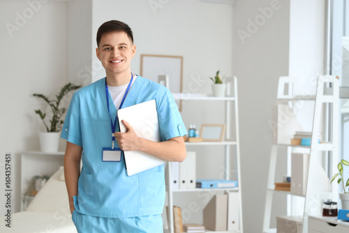 Male medical intern with la...
