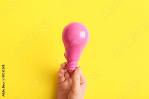 Female hand with pink light...