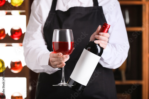 Sommelier holding a glass o...