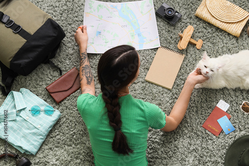 Young woman with map, cute ...