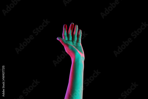 Toned female hand on dark b...
