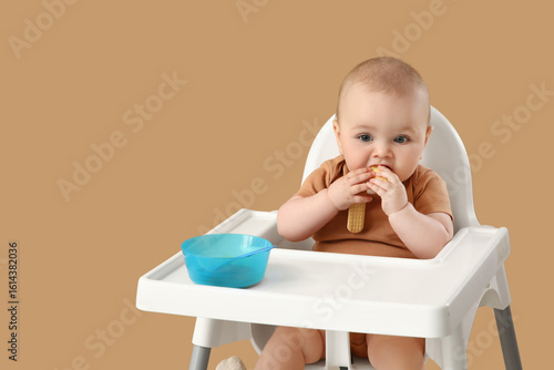 Cute little baby eating in ...