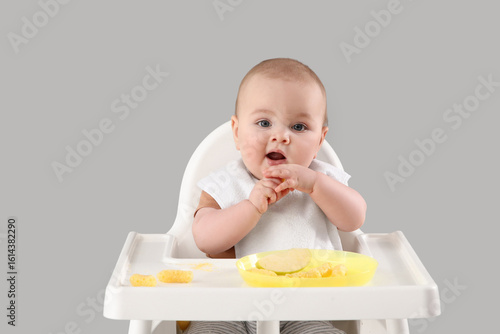 Cute little baby eating in ...