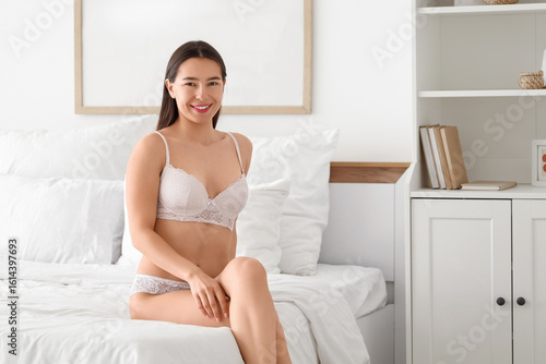 Happy young woman in sexy w...