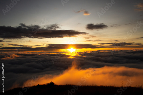 Sunrise Above the Clouds with Golden Light and Dramatic Sky